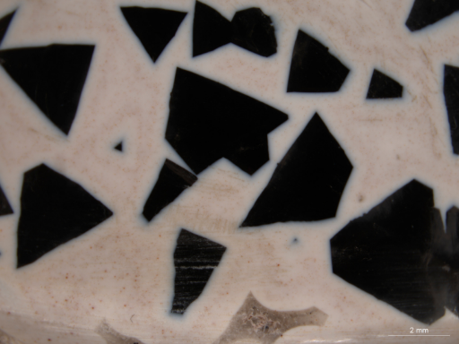 Pyramidal tops of quartz embedded in beige chalcedony | GGTL