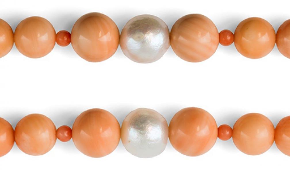 Beads cut from gastropod mollusc shell disguised in a coral necklace