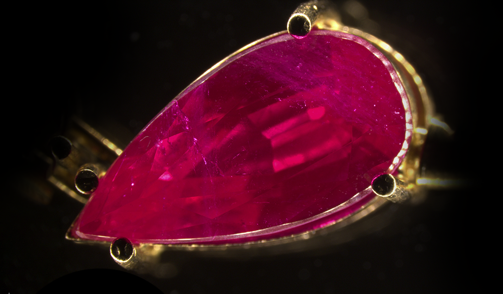 A jewel with a large number of flux-grown synthetic rubies 